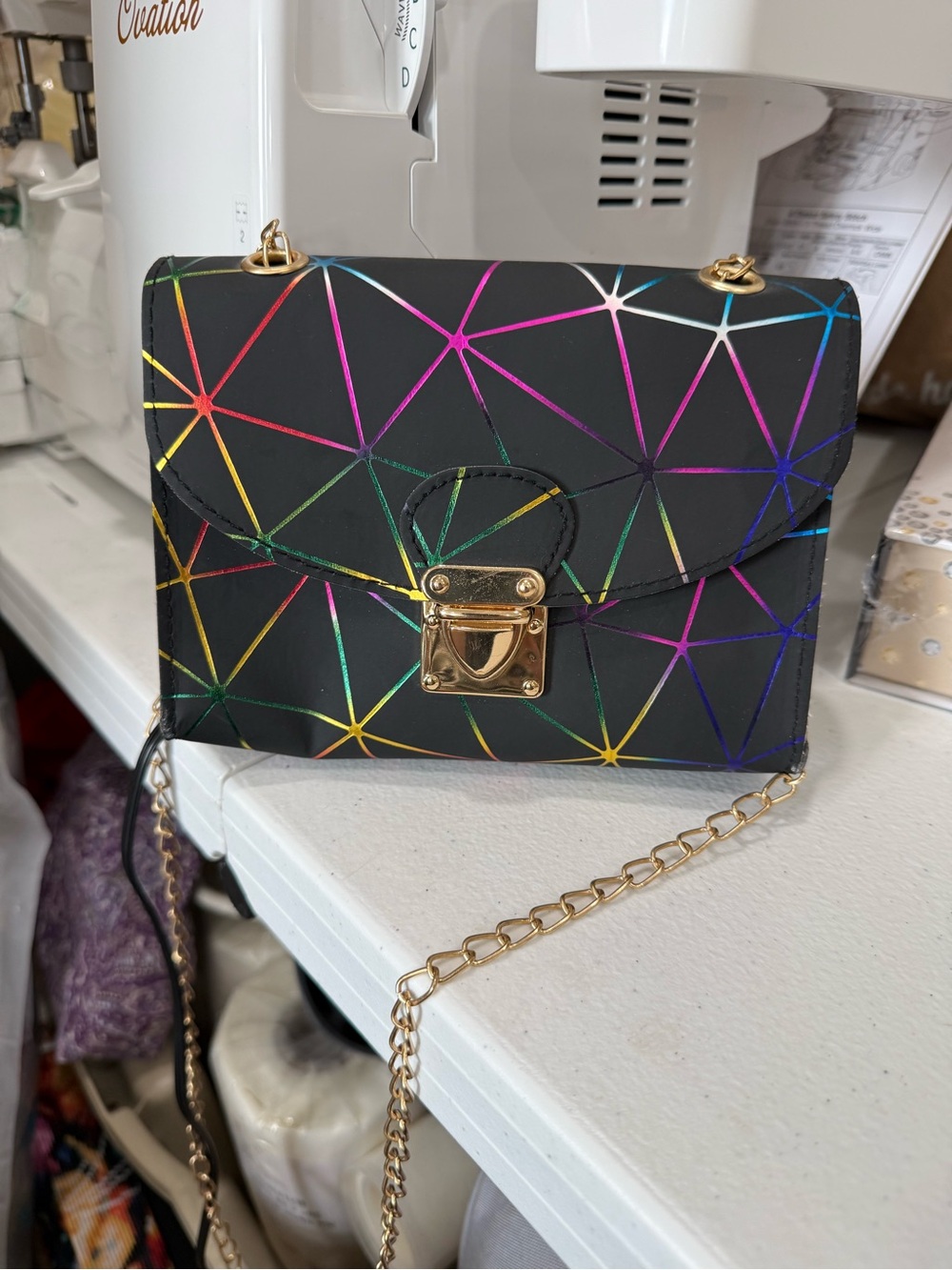 Black Crossbody Bag with Iridescent Geometric Accents